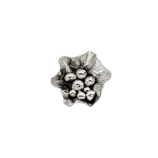 Sterling silver, handmade, freeform flower ring on white background. Front view, close up of flower, filled with many silver balls of varying size snd blackened at the center..